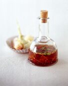 Ginger dressing with hot chili in glass bottle