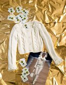 Knitted short woollen jacket with cards on golden foil