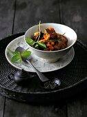 Lamb curry with apricots in bowl