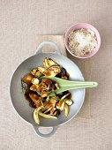 Chicken with fennel, mushrooms and nuts in serving bowl