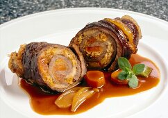 Close-up of beef roulades with papaya and sauerkraut filling on plate