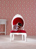 Set of gold rings on dollhouse chair