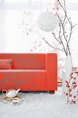 Red sofa on white flokati rug