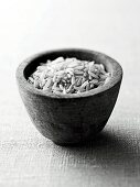 Brown rice in pot, black and white