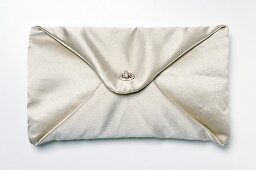 Close-up of silk bag on white background