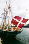 Sailing ship of George Stage moored at port of Copenhagen, Denmark