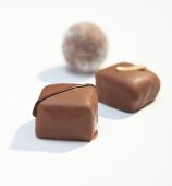 Three different types of chocolates on white background