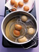 Mini doughnuts being fried