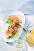 Seafood kebab with diced salmon and king prawns served on plate