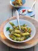 Braised cucumbers with dill and chilli peppers
