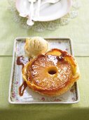 Pineapple tart with caramelized puff pastry and ice cream in serving dish
