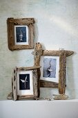 Three wooden photo frames on wall