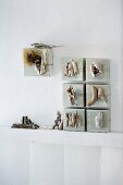 Driftwood and flotsam and jetsam arranged artistically on canvases leaning against a wall