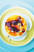 Beetroot and carrot gratin with pistachios