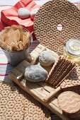 Close-up of wooden forks, bread and picnic cutlery