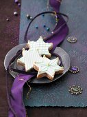 Cinnamon stars with icing and golden sugar pearls