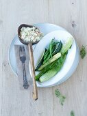 Risotto with salmon served with green vegetables