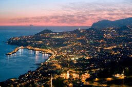 Aerial view of illuminated Funchal harbour at dusk in Madeira island, Funchal, Portugal