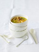 Potato and apricot soup with croutons and pine nuts