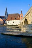 View of Cathedrals and Stone Bridge over Danube river in Regensburg, Germany