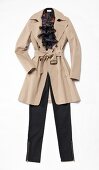 Beige trench coat with black pants on white background