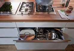 Kitchen worktop with hob and drawer with utensils