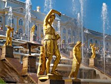 View of sumptuous bronze figures in front of Peterhof Palace in St. Petersburg, Russia