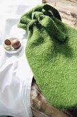 Close-up of green hot bottle cover 