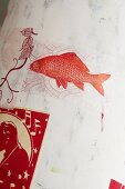 Red fish painted on white screen