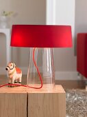 Close-up of glam table lamp with red glass