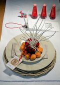 Rattan coasters with plates, twigs, walnuts and place card