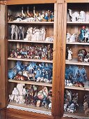 Close-up of wooden shelf with nativity figurines