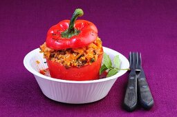 A red pepper filled with rice and minced meat