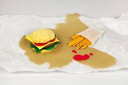 Burgers and fries on white background