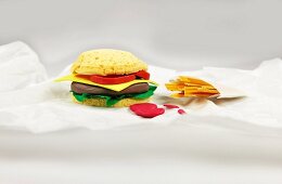 A burger and fries made from paper