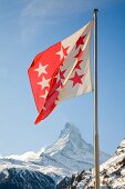 View of Matterhorn mountain and Valais flag in Switzerland