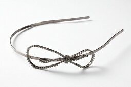 Close-up of metal hairband on white background