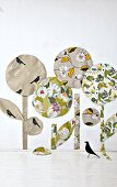 Green and beige floral patterned fabric trees decorations on wall