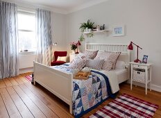 Bedrooms in Scandinavian style with bed, cushion, armchairs and side table