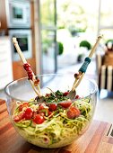 Close-up of zucchini spaghetti in glass bowl on wooden table