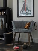 Chair with grey slipcovers and fur pillows with clogs