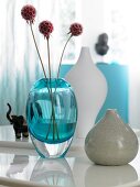 Blue, white and mud coloured vase on table
