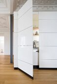 A kitchenette in a cupboard in an apartment in a period building