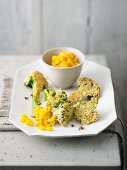 Fried broccoli with sesame and a mango dip