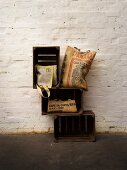 Various recycled bags made of jute bags against white wall