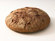 Close-up of herb bread on white background