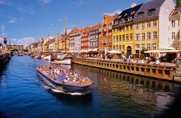 Excursion boat Hustle and bustle at Nyhavn in Copenhagen, Denmark