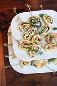 Crespelle with gravlax on a cake stand