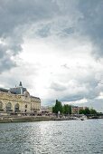 View of Musee d'Orsay Museum overlooking Seine river, Paris, France