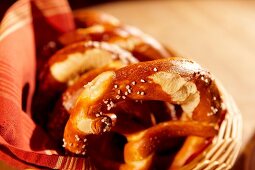 Basket of pretzels on wooden table